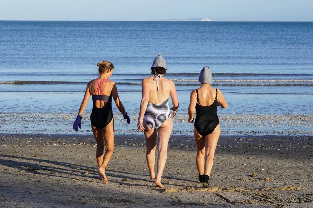 Friends headed for a sea swim at Studland beach with Beach Sauna