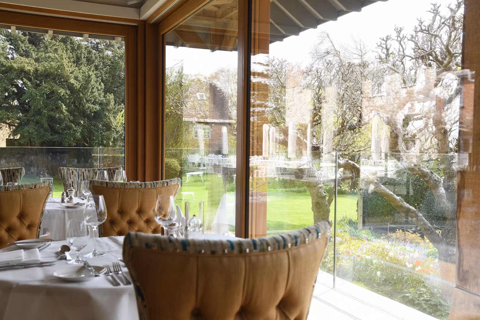 The Garden Room Restaurant at Priory Wareham - The view from the reasturant overlooking the lawn towards the hotel